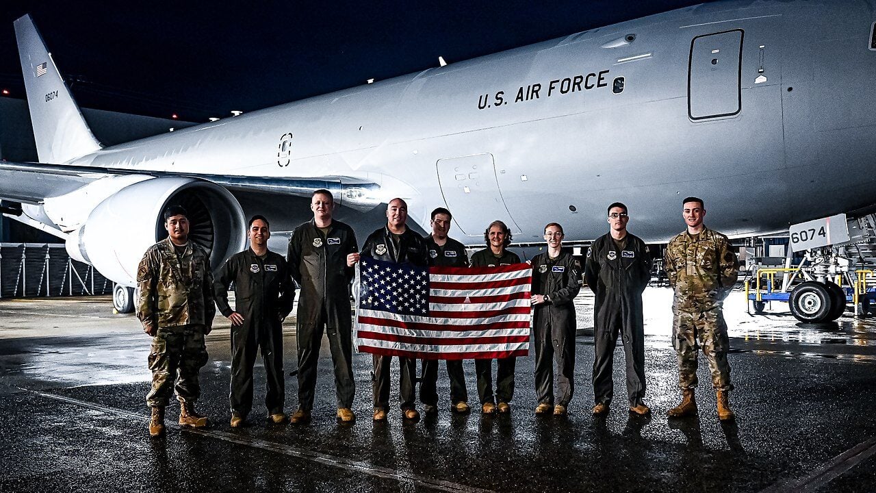 U.S. Air Force pilots and aircrew assigned to the 305th Air Mobility Wing pose for a photo in front of a KC-46A Pegasus Tanker in Everett, Wash. on Jan. 13, 2023.