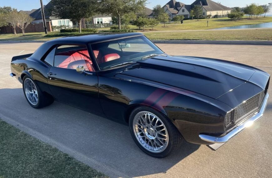 A black 1968 Chevrolet Camaro in the sunshine.