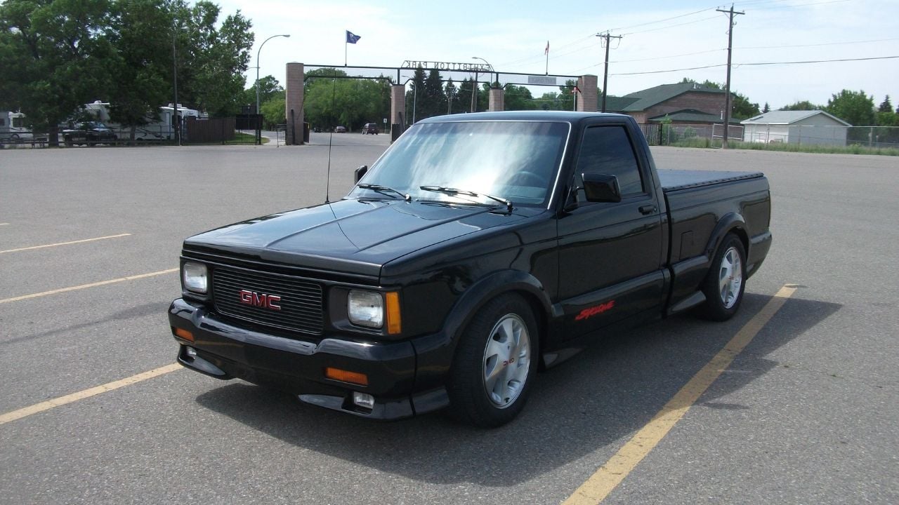 Front 3/4 shot of a black GMC Syclone parked