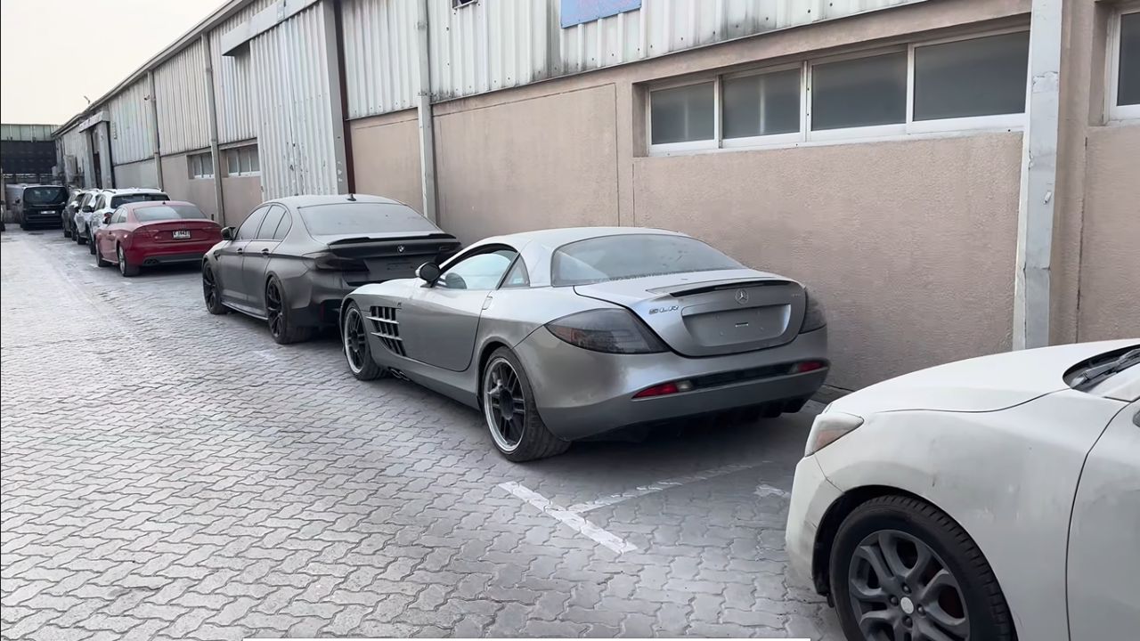 Rear 3/4 view of a dust-covered Mercedes-Benz SLR McLaren 722 parked