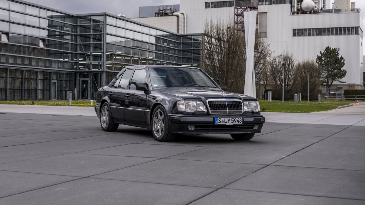 Front 3/4 shot of a Black Mercedes-Benz 500 E parked