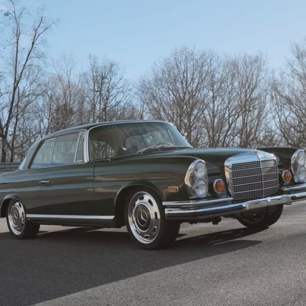 Front 3/4 view of a 1969 Mercedes 280SE Restomod By Retro Designs driving