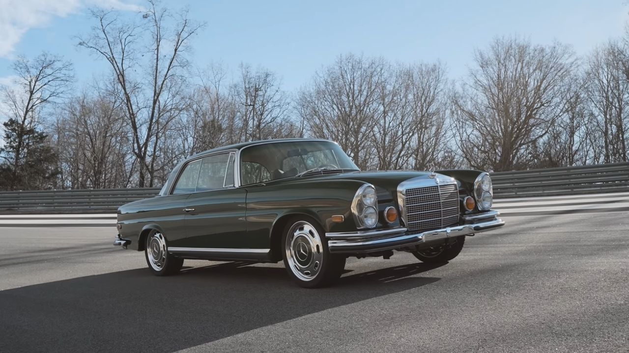 Front 3/4 view of a 1969 Mercedes 280SE Restomod By Retro Designs driving