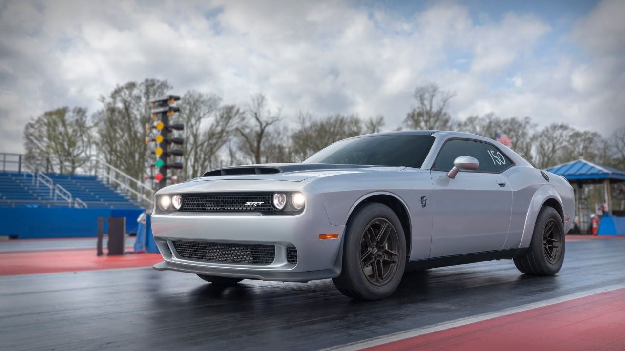 Front 3/4 shot of a Gray Dodge Challenger SRT Demon 170 launching at a drag strip