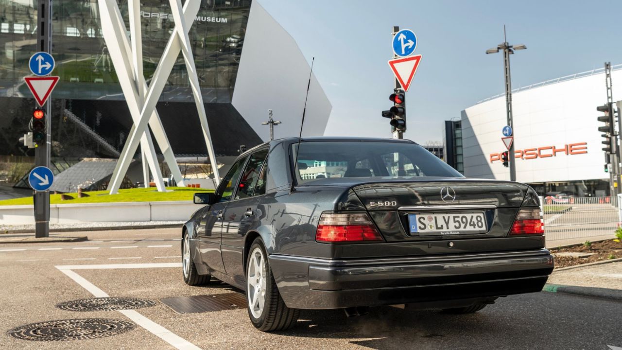Rear 3/4 shot of a Black Mercedes-Benz 500 E parked
