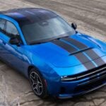 Front 3/4 view of a Blue SIXPACK-powered 2026 Dodge Charger R/T parked