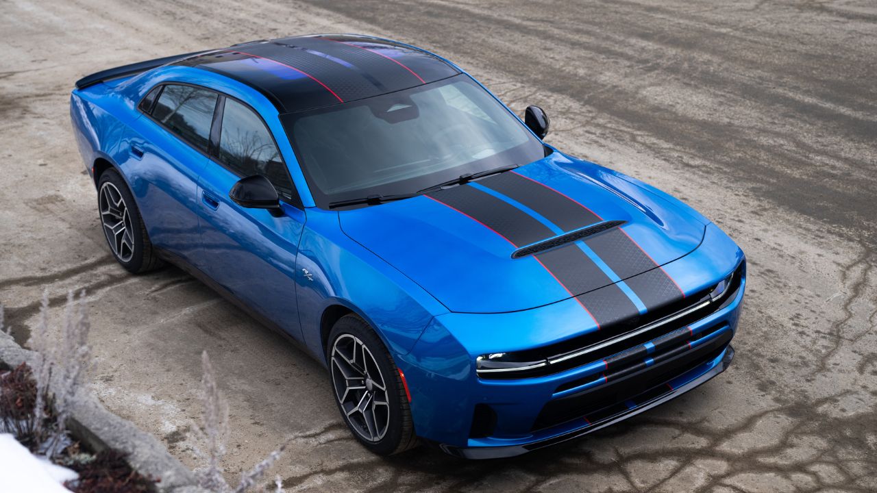 Front 3/4 view of a Blue SIXPACK-powered 2026 Dodge Charger R/T parked