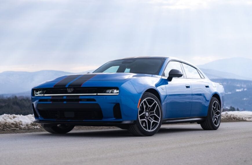 Front 3/4 view of a Blue SIXPACK-powered 2026 Dodge Charger R/T parked
