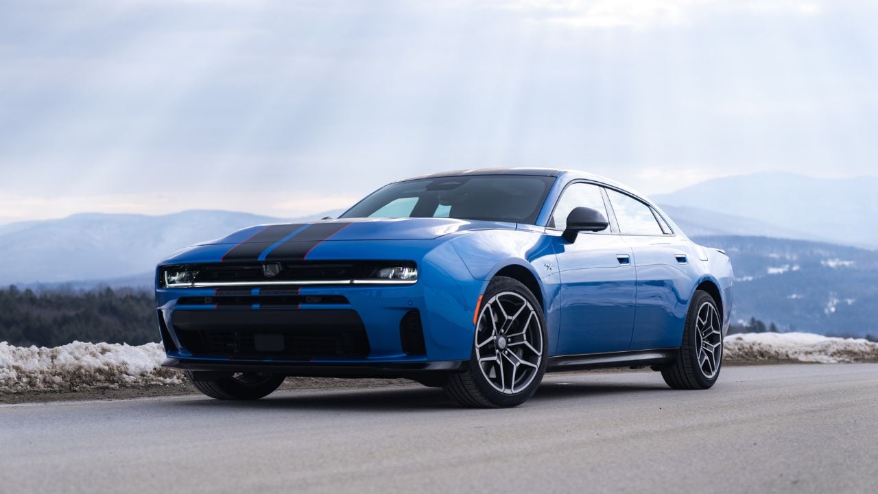 Front 3/4 view of a Blue SIXPACK-powered 2026 Dodge Charger R/T parked