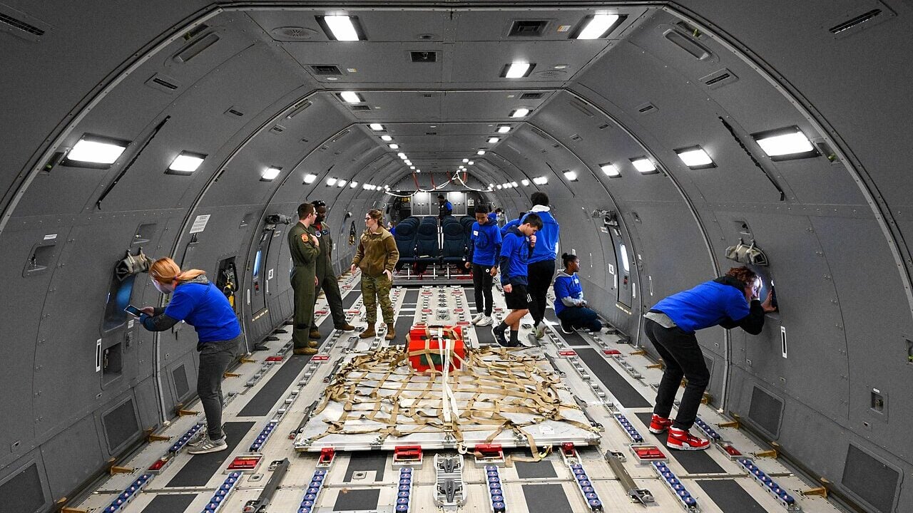 Legacy Flight Academy students explore the cargo area of a KC-46 Pegasus at Joint Base (JB) Charleston, South Carolina, Feb. 18, 2023.
