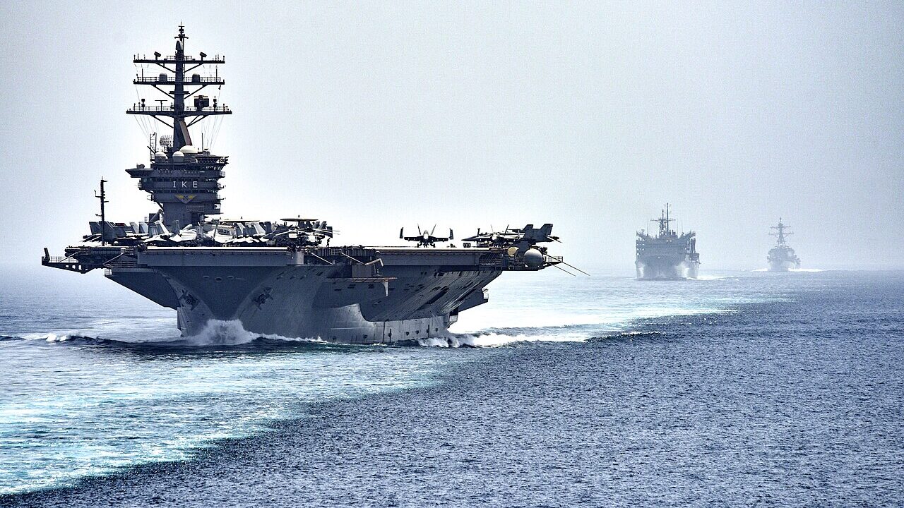 STRAIT OF HORMUZ (July 21, 2016) The aircraft carrier USS Dwight D. Eisenhower (CVN 69), followed by the fast combat support ship USNS Arctic (T-AOE 8) and the guided-missile destroyer USS Nitze (DDG 94), transit the Strait of Hormuz. The Eisenhower Carrier Strike Group is deployed in support of maritime security operations and theater security cooperation efforts in the U.S. 5th Fleet are of operations. (U.S. Navy photo by Mass Communication Specialist 3rd Class J. Alexander Delgado/Released).