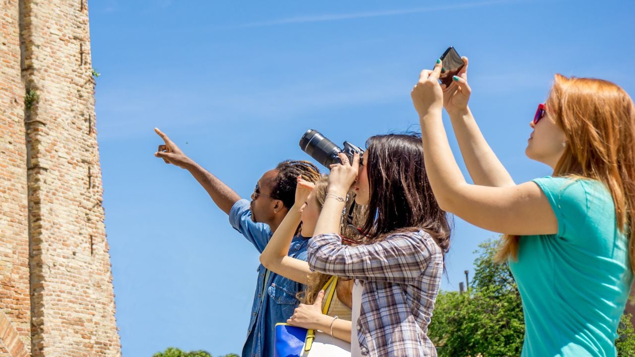 Travelers learning about a destination while touring with a guide