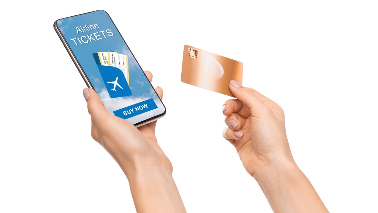 Book Flights Online. Closeup Of Woman Buying Arline Tickets With Mobile App On Smartphone and Credit Card.