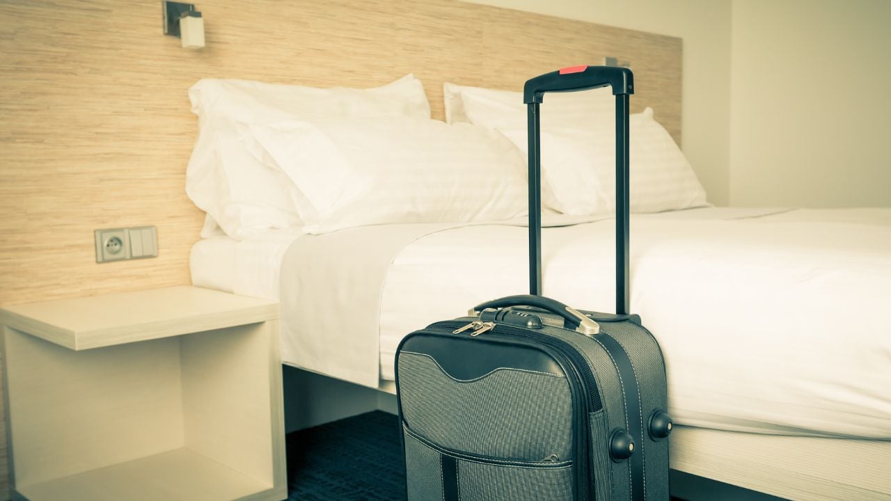 Prepared fresh bed, scene in hotel room. Horizontal retro toned shot