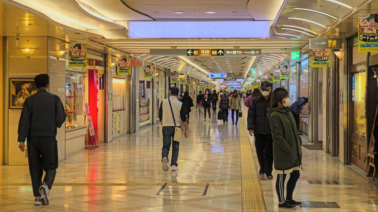 Osaka, Japan - November 5 2020: Looking down Namba Walk in central Osaka, a long underground shopping mall connecting several train stations