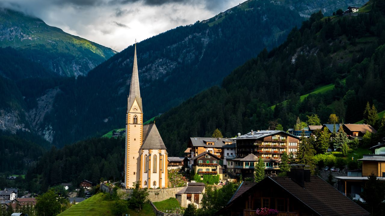 Village Of Heiligenblut In Front Of Mountain Großglockner In The Clouds In Austria
