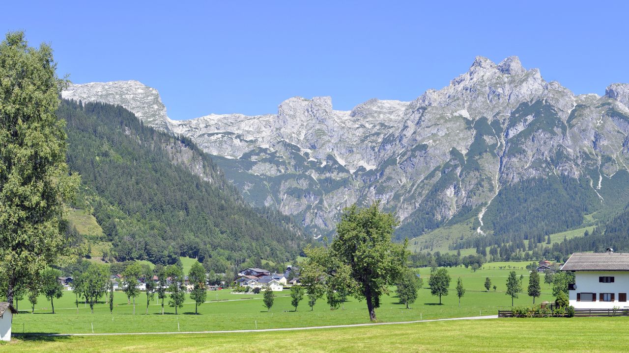 panorama photo of austrian village Werfenweng, peak Eiskogel in Tennen Mountains (Tennengebirge) which are part of the Northern Limestone Alps in the state of Salzburg, Austria.