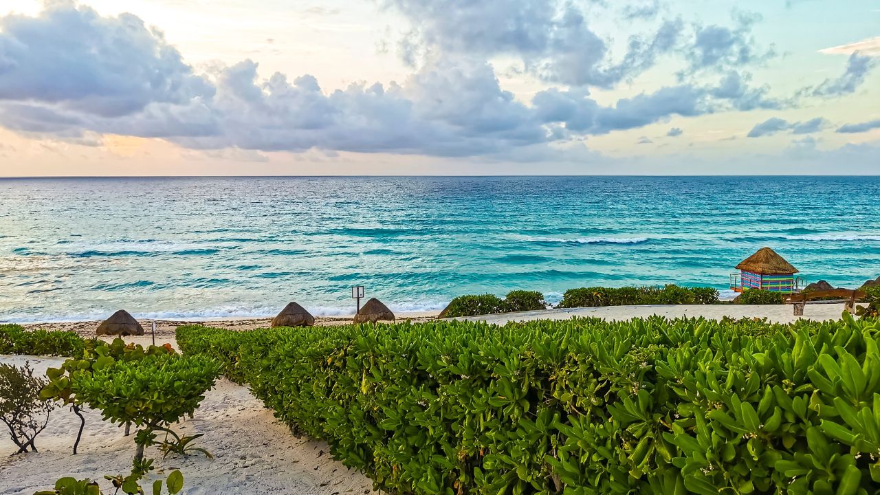 Caribbean Beach Playa Delfines with amazing sunrise in Cancun Quintana Roo Mexico.