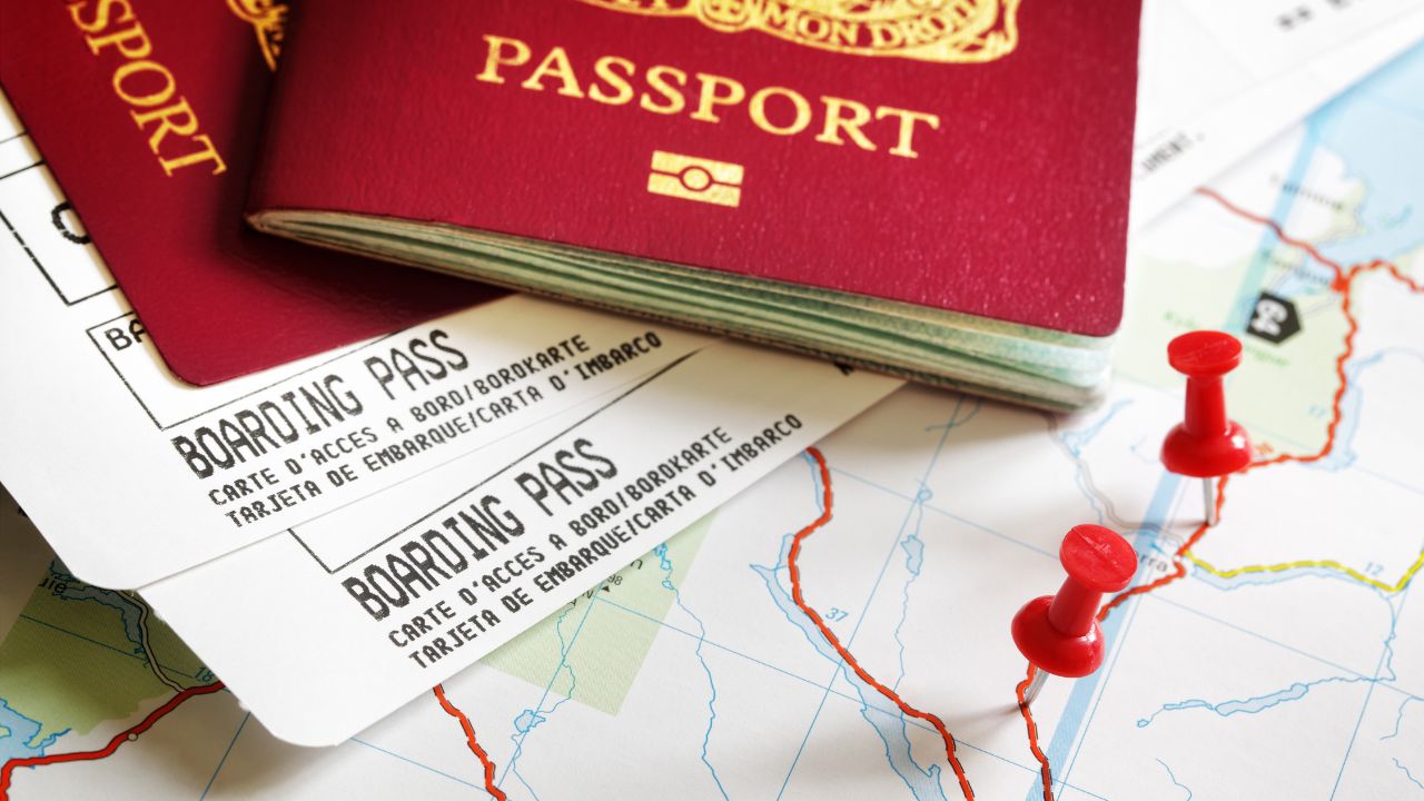 Boarding pass and passport on map with thumbtack concept for travel and vacations