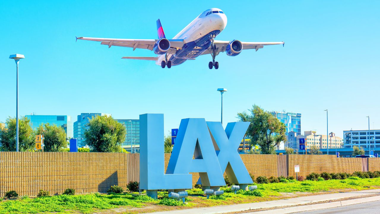 Los Angeles, California - February 1, 2023: Delta Airlines plane takes off over the iconic LAX sign at Los Angeles International Airport