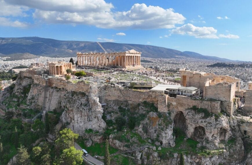 Aerial drone photo of iconic Acropolis hill and the Parthenon featuring Erechtheion and Porch of the Caryatids, Athens historic centre, Attica, Greece
