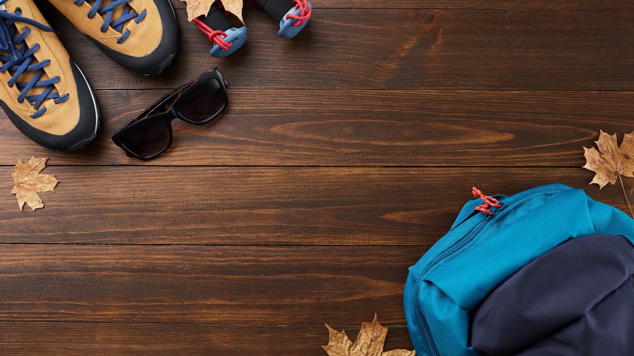 Hiking gear including boots, backpack, and trekking poles