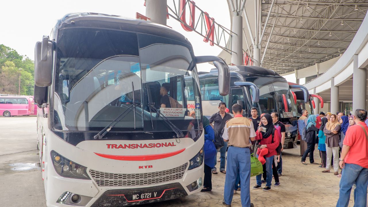 People queuing at a bus terminal