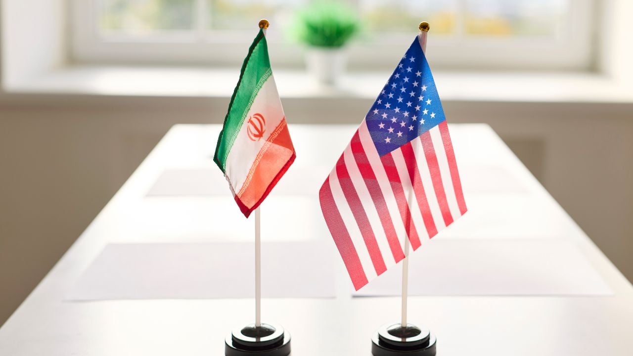 Iran and United States flags on a conference table