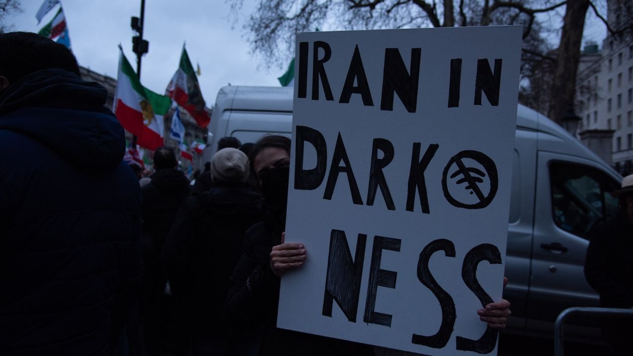 Protester holding a sign at a demonstration in London