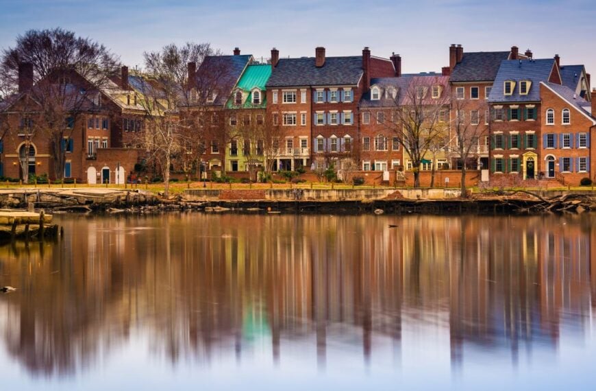 Reflections of waterfront buildings along the Potomac River in Alexandria, Virginia.