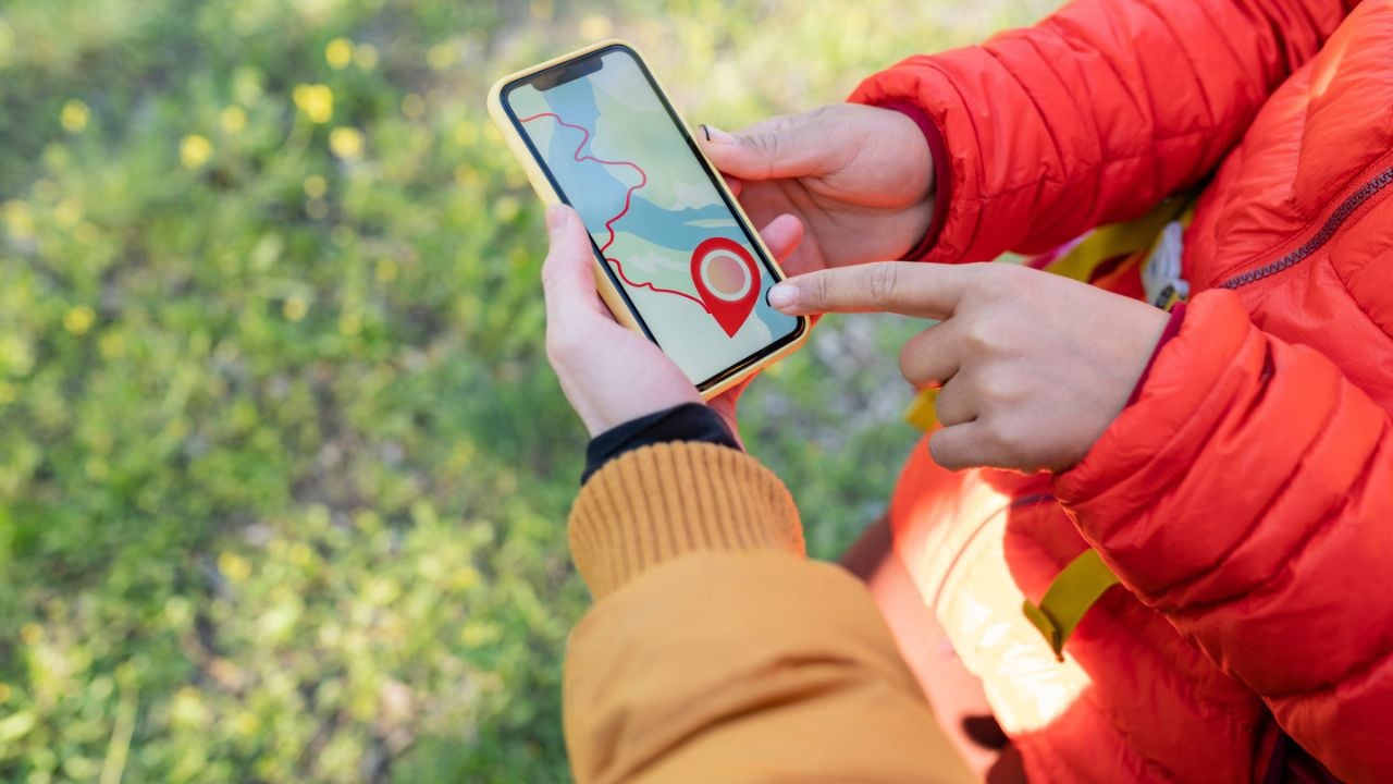 backpackers travel to the mountains with a smartphone, in the mountains, a mobile phone in the Carpathians, sailing couple in the mountains with a mobile phone.