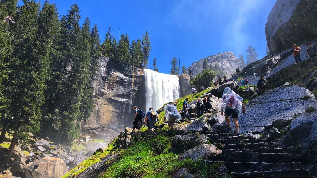 YOSEMITE, CA, USA - MAY 2, 2018: Tourist climbing mist trail to the top of Vernal falls in the national park