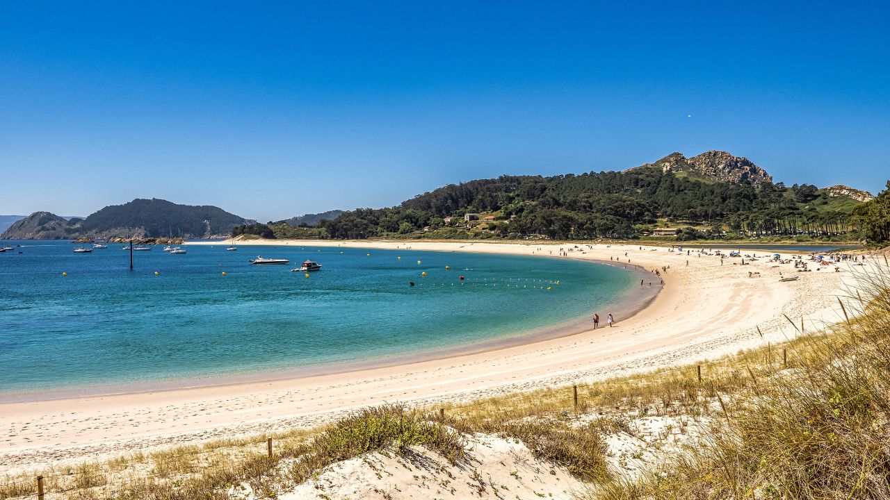 Cies Islands, Spain - Jul 01, 2023: Beach of Rodas in Cies Islands nature reserve, white sand and clear turquoise water. Atlantic Islands of Galicia National Park, Spain.