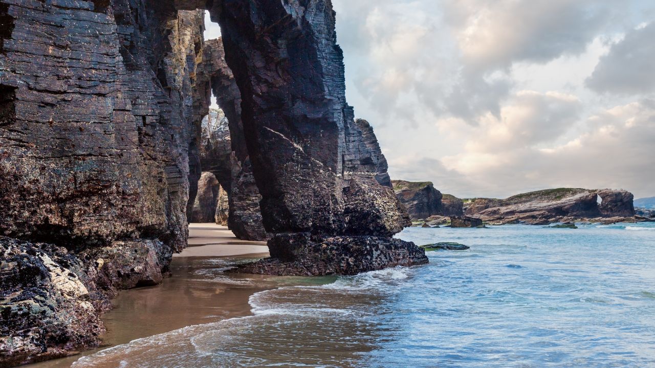Natural rock arches on Cathedrals beach in low tide (Cantabric coast, LugoNatural rock arches on Cathedrals beach in low tide (Cantabric coast, Lugo (Galicia), Spain). (Galicia), Spain).