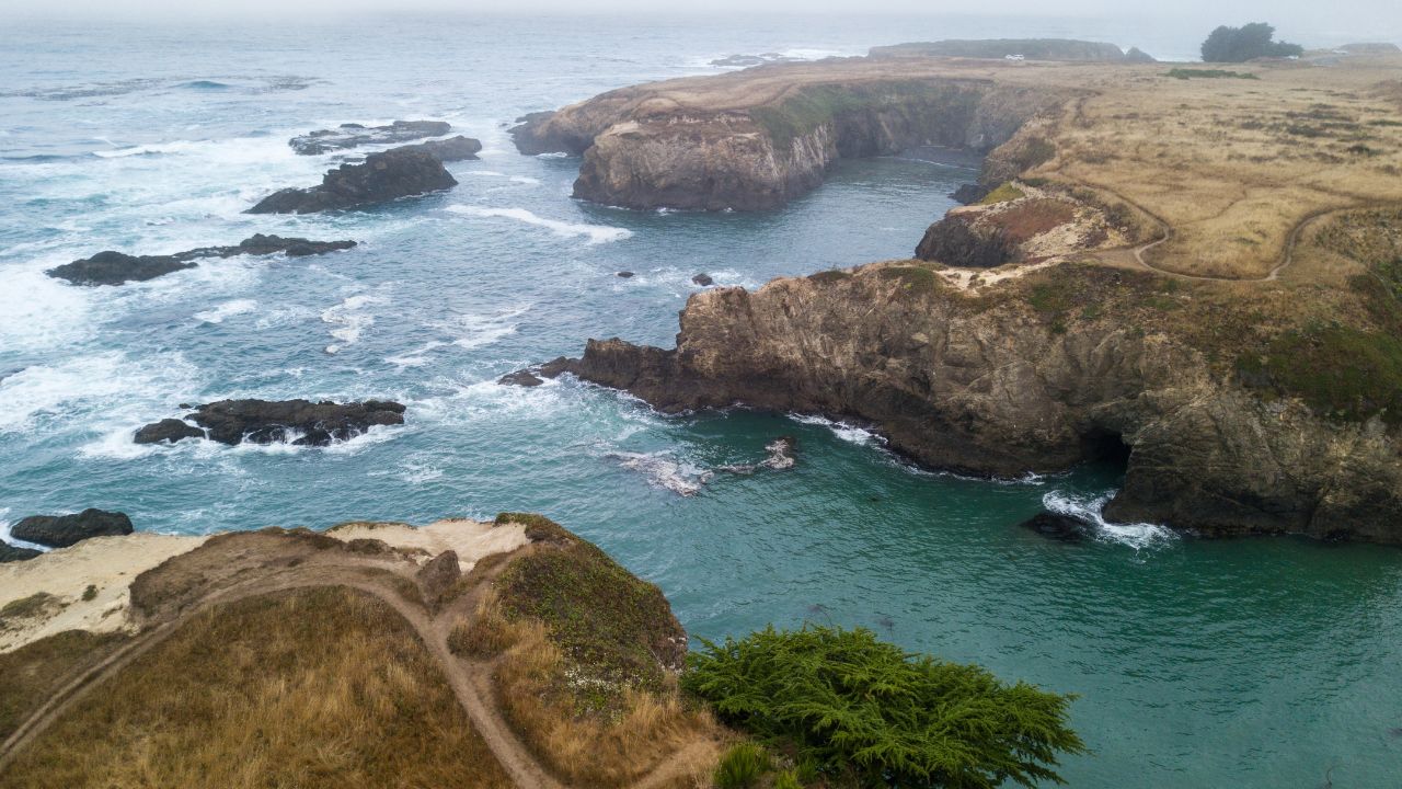 The ocean washes against the dramatic northern California coastline in Mendocino. This part of the west coast is one of the most picturesque areas in the United States.