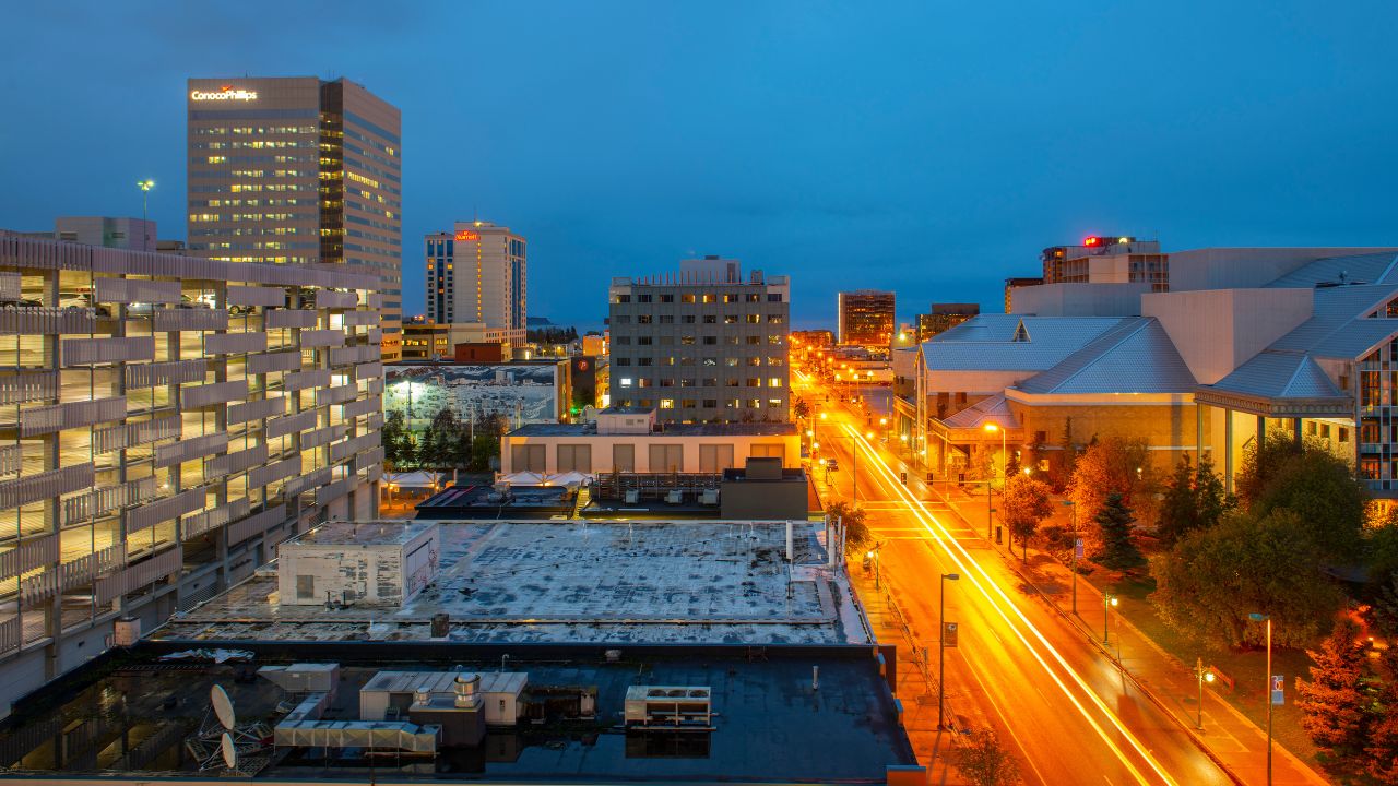 ANCHORAGE, ALASKA, USA - SEP. 21, 2019: Anchorage downtown including Conoco Phillips building and Marriott Anchorage building aerial view at night of the Sixth Avenue in downtown Anchorage, AK, USA.