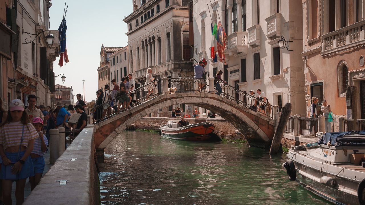 Gondola on a canal in Venice, Italy, surrounded by Venetian architecture