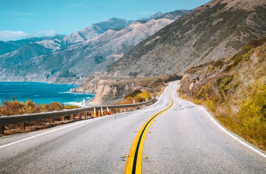 Scenic view of world famous Highway 1 with the rugged coastline of Big Sur in beautiful golden evening light at sunset in summer, California Central Coast, USA