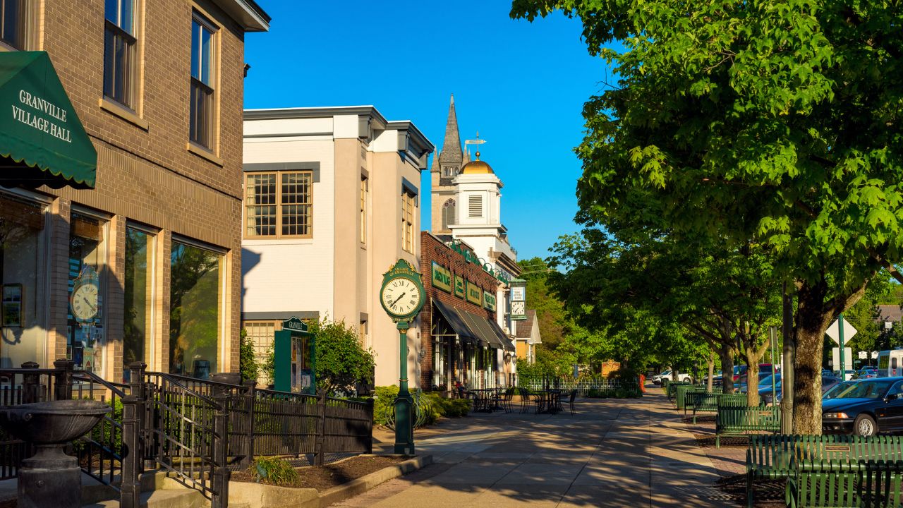 GRANVILLE, OH - MAY 15, 2017: Churches and businesses line a shady block of Broadway Avenue in this small college village in east central Ohio.