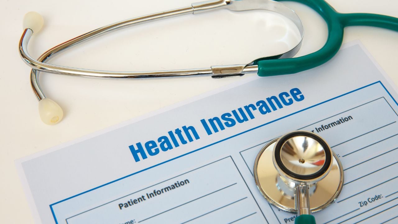 Health insurance with insurance claim form and stethoscope. Health insurance concept