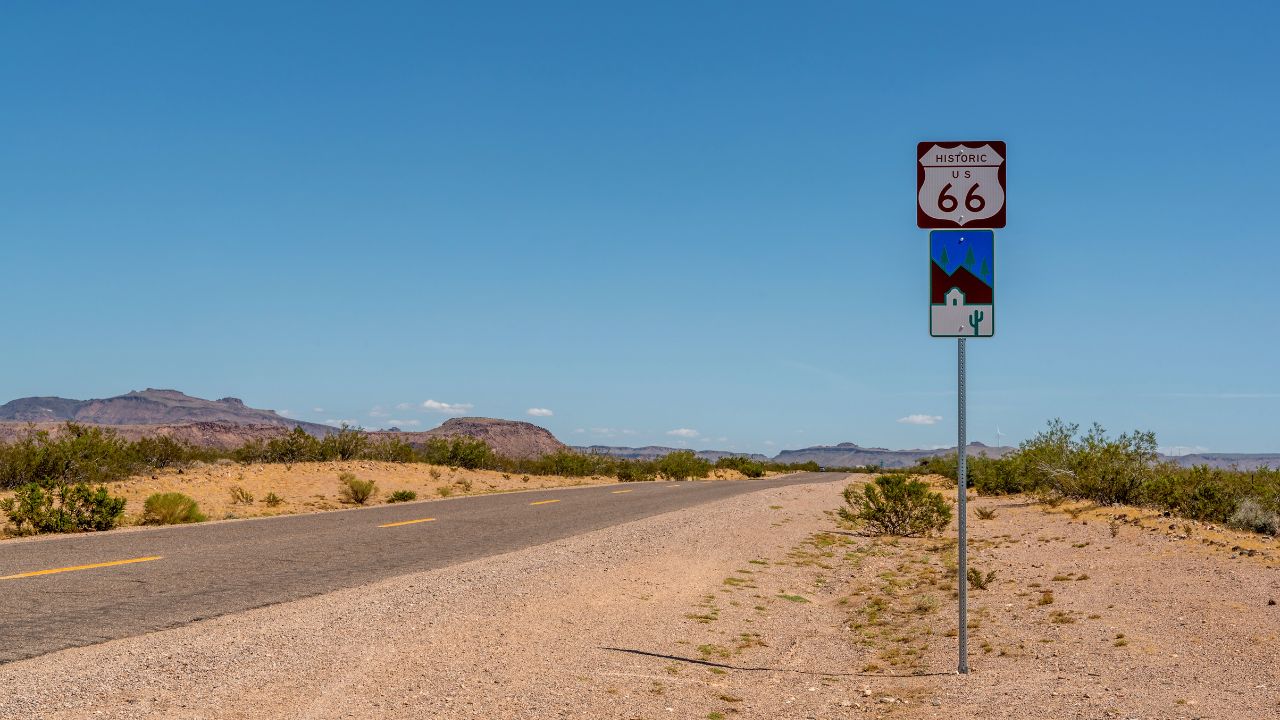 Route 66 sign on the side of the road in the desert in Arizona