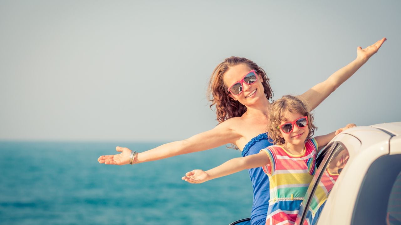 Happy family travel by car. People having fun on the beach. Summer vacation concept