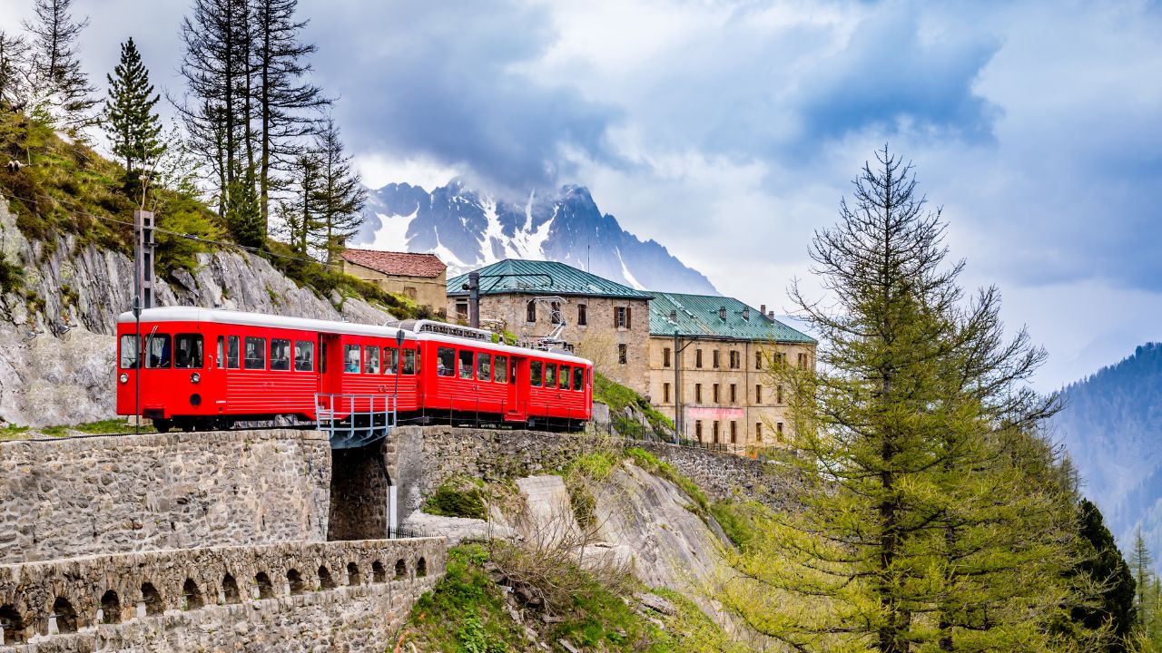 Red Train going To Montenvers Mer de Glace Station over Mont Blanc Massif in Chamonix,France