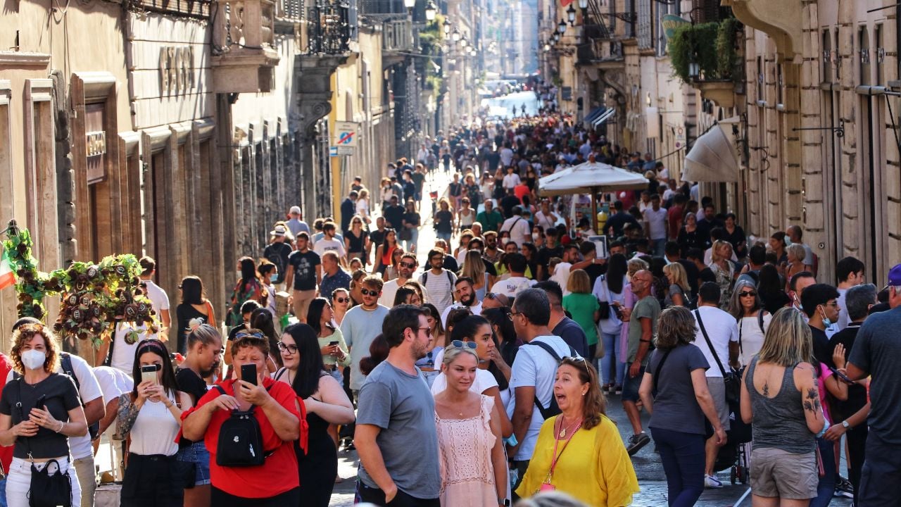 Rome, Italy - The people of Italy. A crowded pedestrian street full of tourists and locals during the summer in the center of Roma.