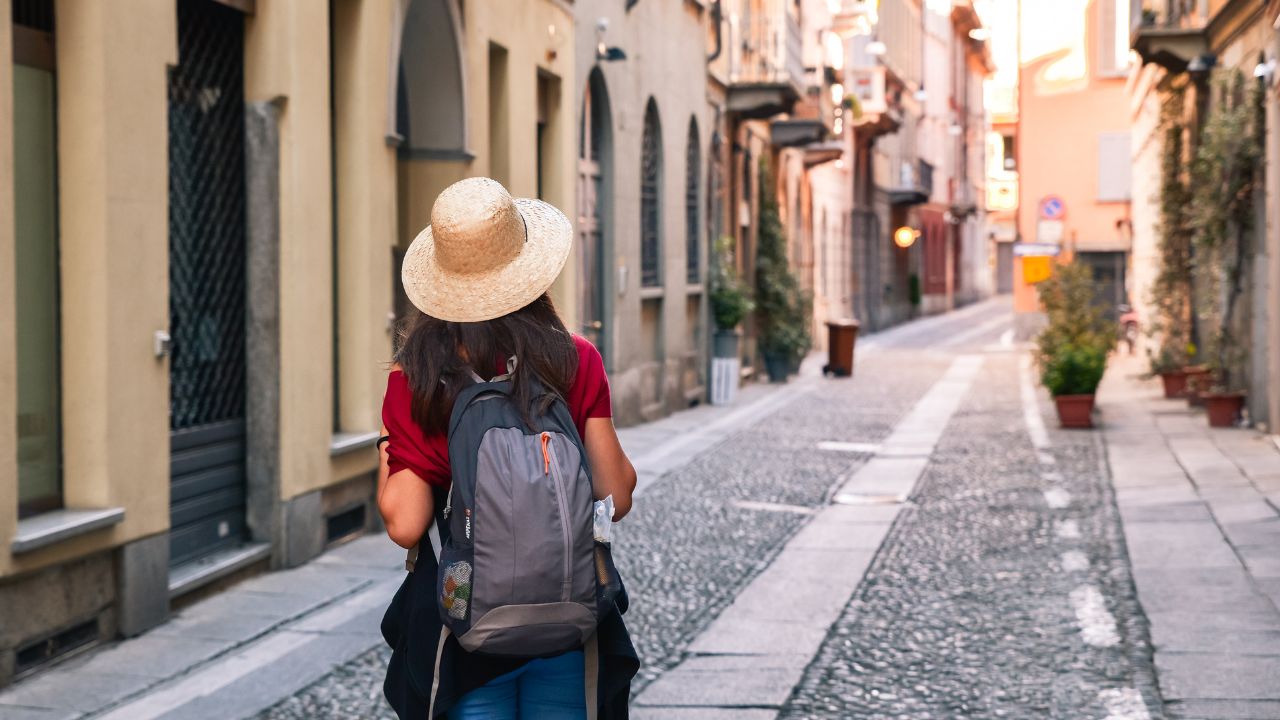 Tourism in Europe, woman tourist walking on the street