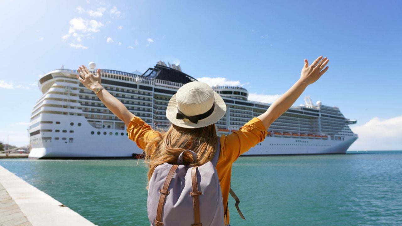 Traveler standing in front of a large cruise ship