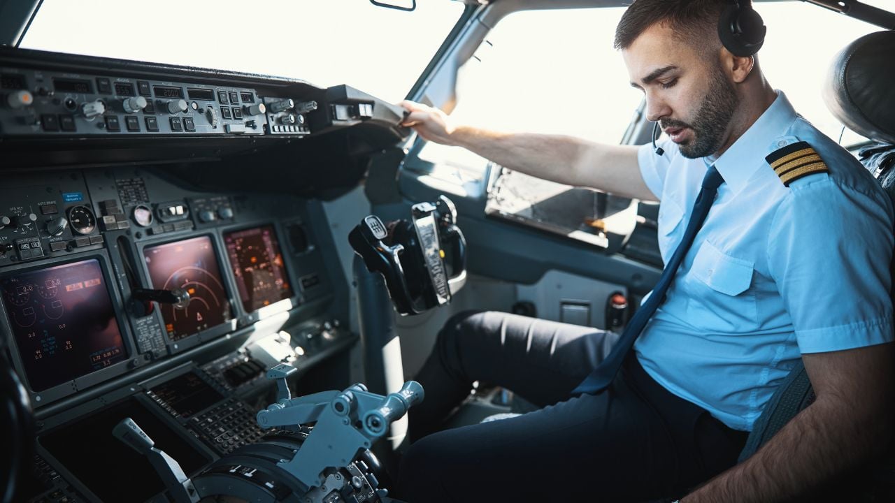 Handsome Caucasian pilot getting ready for the journey