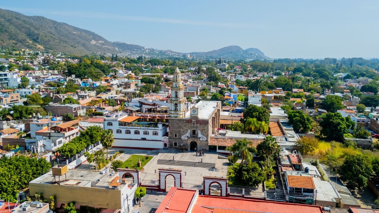 Aerial view of Ajijic town with its church and surrounding buildings, mountains, and lake chapala in jalisco, mexico