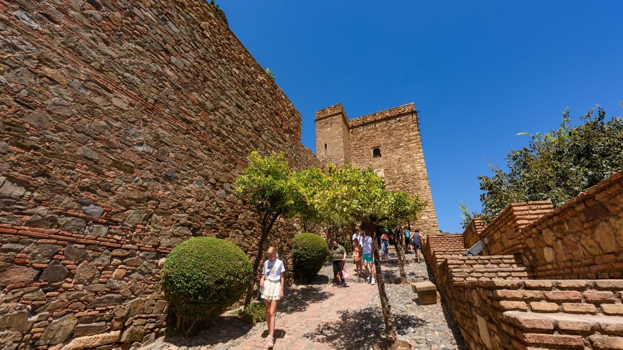 Malaga, Spain - August 06, 2024: Walking through the Alcazaba fortress in Malaga, Spain.