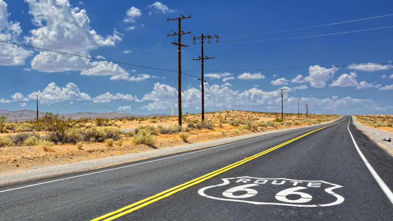 U.S. Route 66 highway, with sign on asphalt on California.